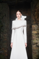 Elegant Tracy Studio Diagonal Crystal-Embellished Shoulder A-Line gown with intricate crystal details and flowing fabric.