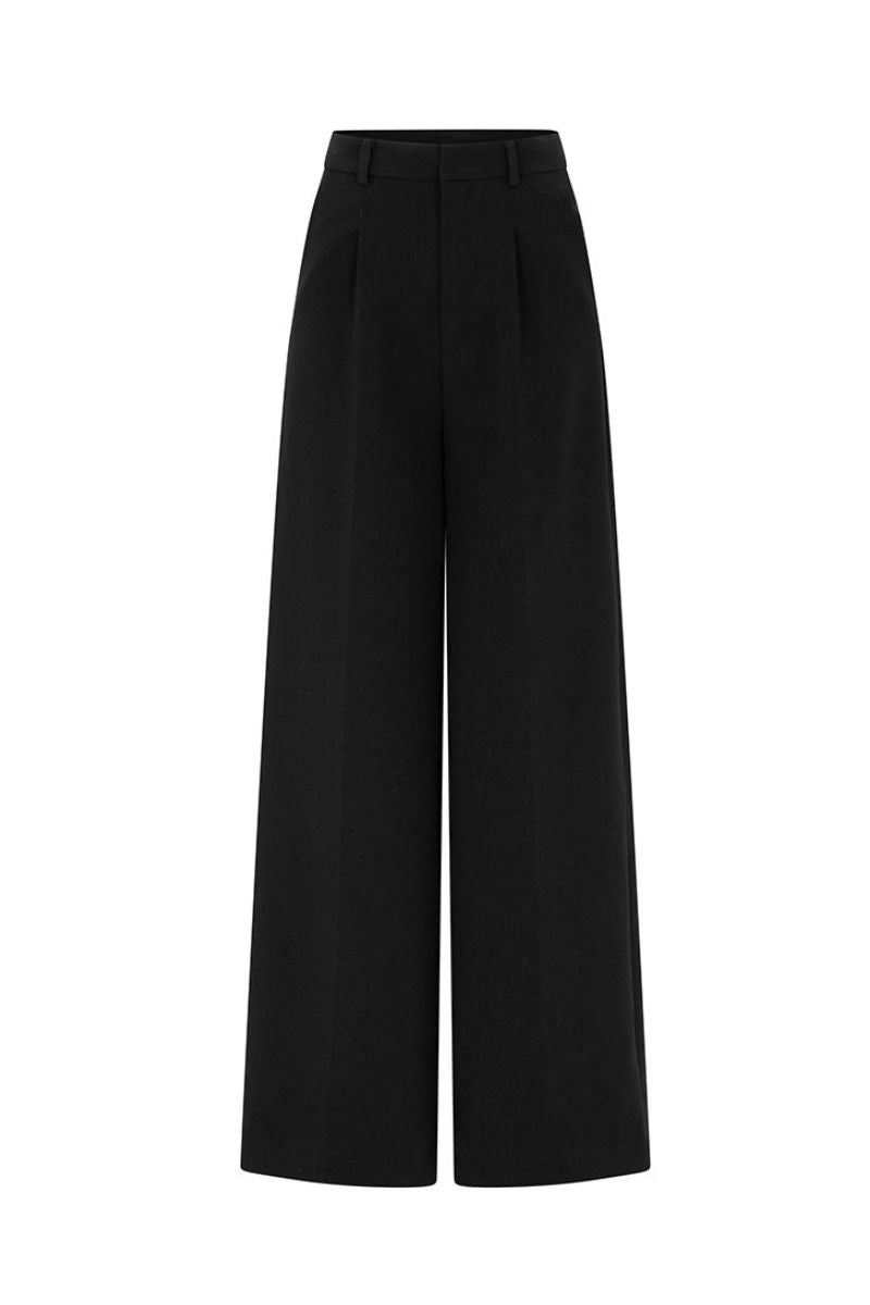Black Valenciani wide leg trousers displayed on a hanger with a relaxed fit and high waist.