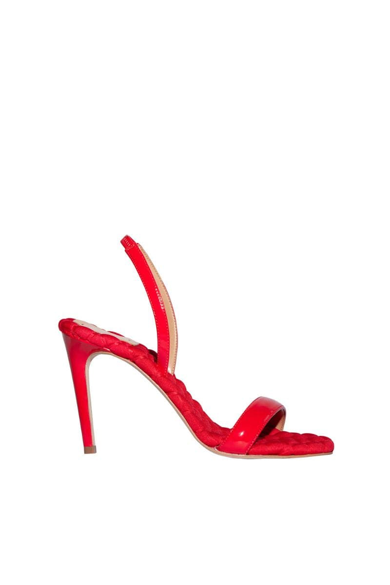 A pair of AERA Vivien red patent-effect slingback sandals with open toes and ankle straps on a neutral background.
