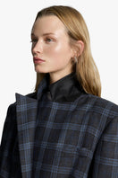 Acaria Studio Charlotte coat in neutral fabric, showcasing a stylish, tailored coat with a collar and front buttons.
