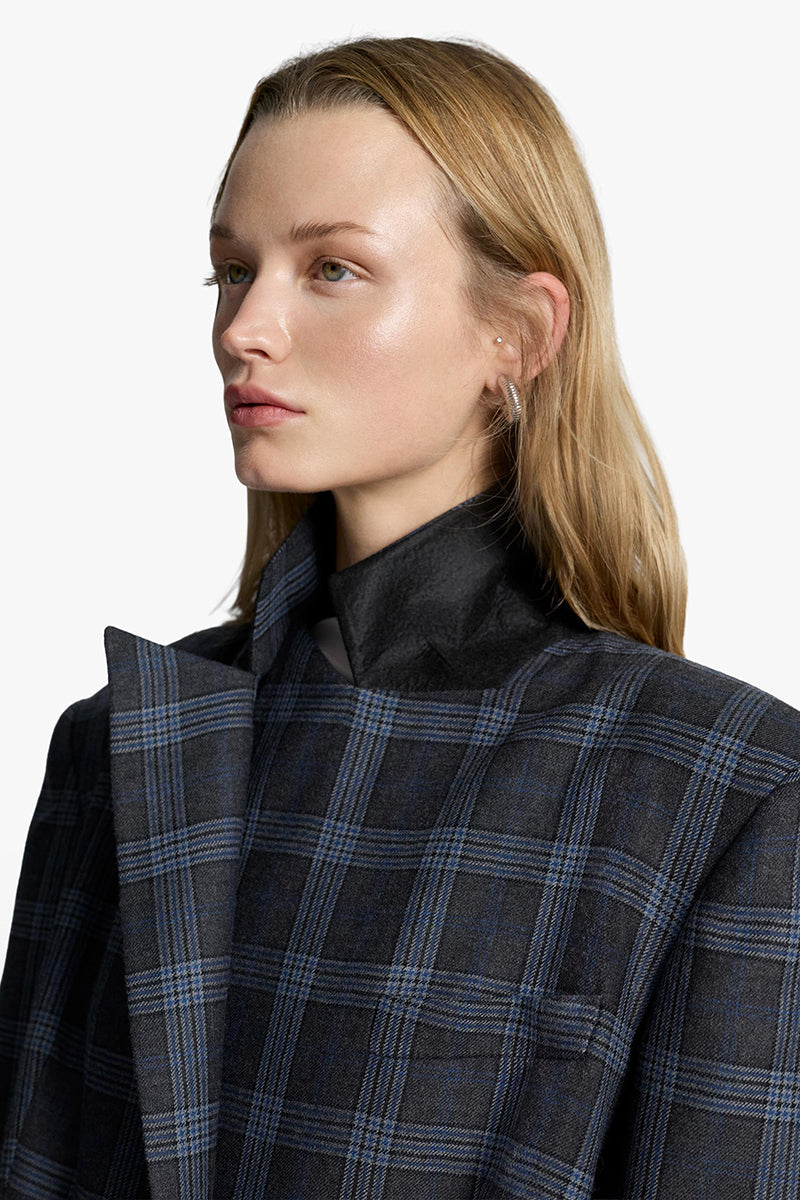 Acaria Studio Charlotte coat in neutral fabric, showcasing a stylish, tailored coat with a collar and front buttons.