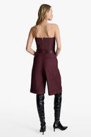 Acaria Studio Guru Shorts in red wine color, casual shorts with a relaxed fit, shown on a model against a neutral background.