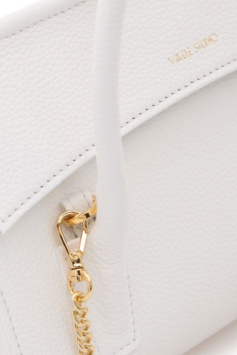 White CELINE mini top handle bag by VIKELE STUDIO featuring a sleek design and compact size.