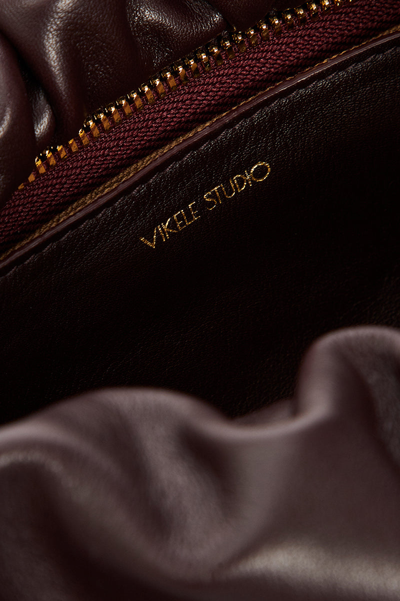 Vikele Studio Rosie bag in burgundy shoulder bag with sleek design and adjustable strap, suitable for everyday use.