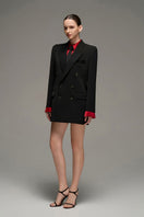 Black oversized double-breasted blazer from I.H.F Studio, featuring wide lapels and a relaxed fit, shown on a model.