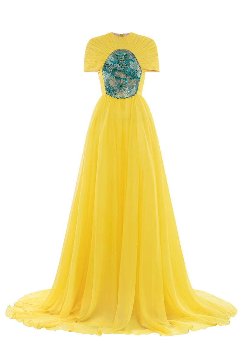 Elegant dragon sun-gown by Le Thanh Hoa, featuring intricate dragon designs and flowing fabric in a traditional gown style.