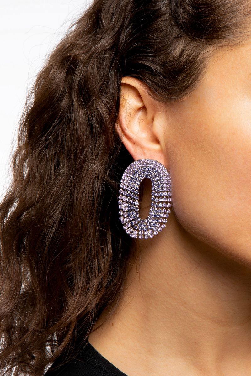 Silvia Gnecchi Liberty double earrings featuring intricate silver designs and elegant dangles on a white background.