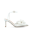 White lace bow slip-on heels by House of Atana featuring elegant design and comfortable heel height.
