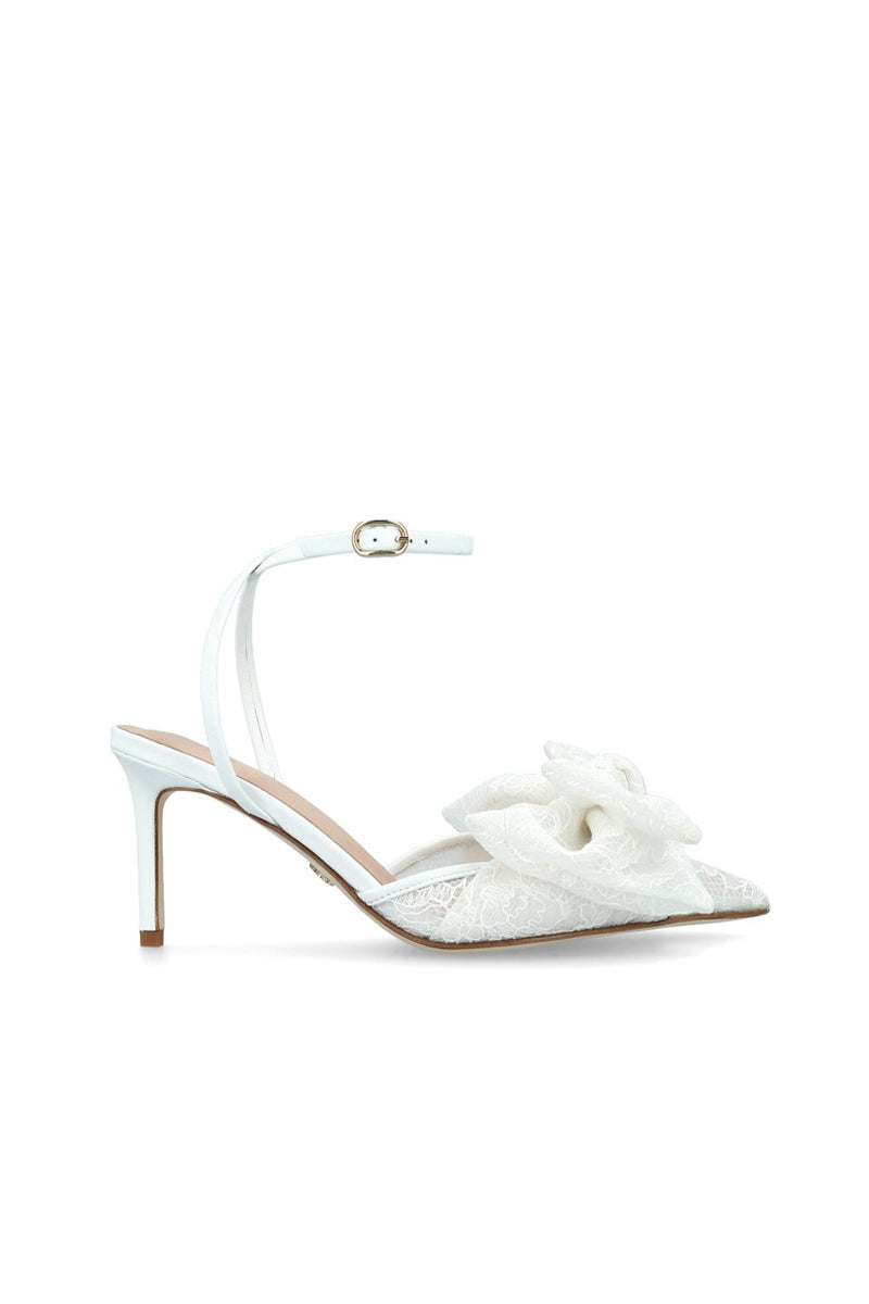 White lace bow slip-on heels by House of Atana featuring elegant design and comfortable heel height.