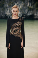 Black velvet satin boat neck gown by Lune De Soie, featuring a sleek, elegant design with a smooth satin finish.