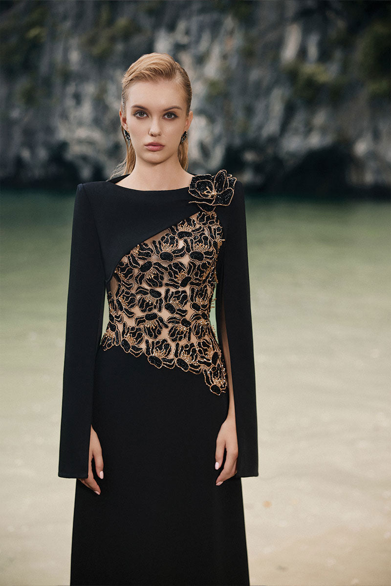 Black velvet satin boat neck gown by Lune De Soie, featuring a sleek, elegant design with a smooth satin finish.