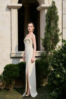 Elegant matte weave gown by Tracy Studio featuring a flowing silhouette and textured fabric in a stylish design.