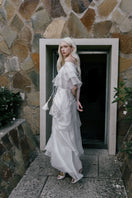 White Plan Thomas maxi dress with flowing fabric and sleeveless design, perfect for summer wear.