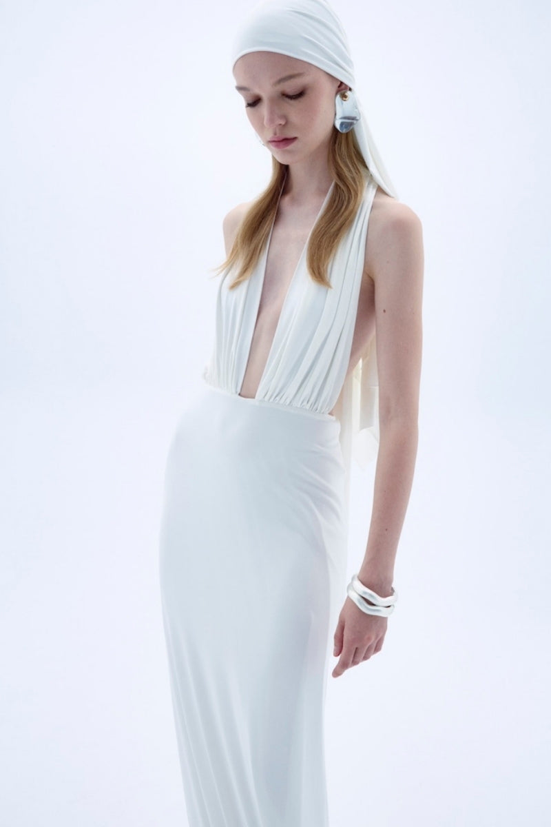 Nazlı Ceren INES long white jersey maxi dress displayed on a model, featuring a flowing silhouette and elegant design.