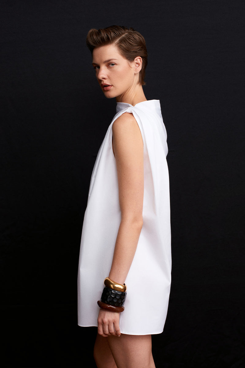 Acaria Studio Roma Mini Dress displayed on a model featuring a stylish short dress with a fitted silhouette and trendy design.