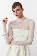 Nazlı Ceren Freya mini dress in vanilla ice displayed on a hanger, featuring a fitted silhouette and sleeveless design.