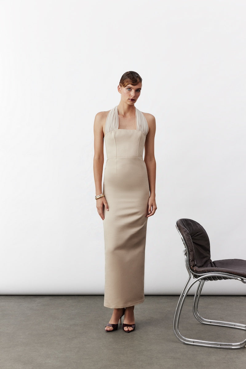 Nazlı Ceren Clarine long maxi dress in Cuban Sand with flowing fabric and elegant design, perfect for summer occasions.
