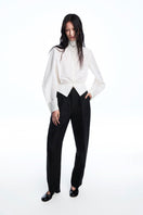 Chictopia sculpted waist shirt showing a fitted, stylish design with a tailored silhouette and button details on a mannequin.