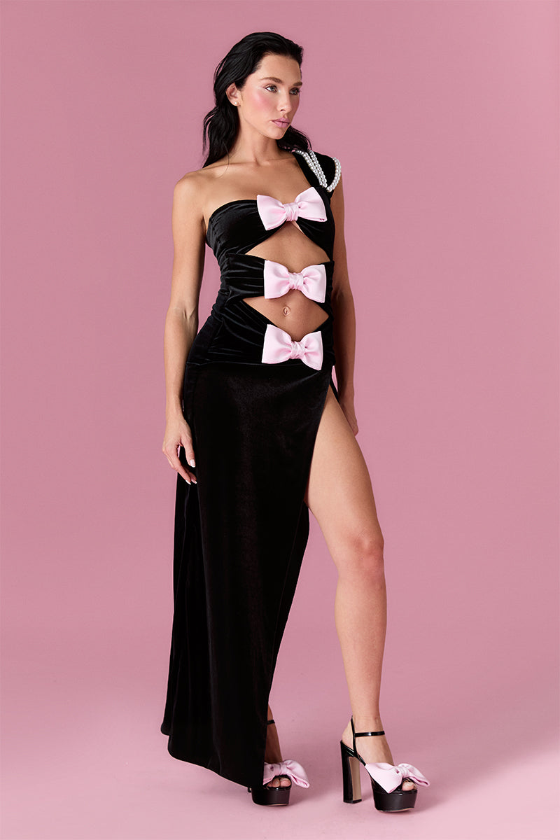 Nur Karaata Midnight Muse gown featuring a sleek, elegant design with flowing fabric and a sophisticated silhouette.