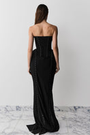 Black MUNA gown with hook details by BALYKINA, featuring a flowing fabric and elegant design.