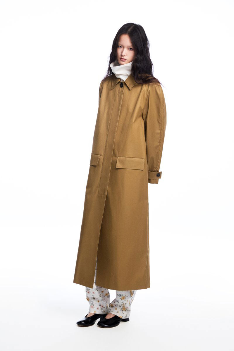 Long brown trench coat with a collar from Chictopia, displayed on a hanger with a classic, stylish design.