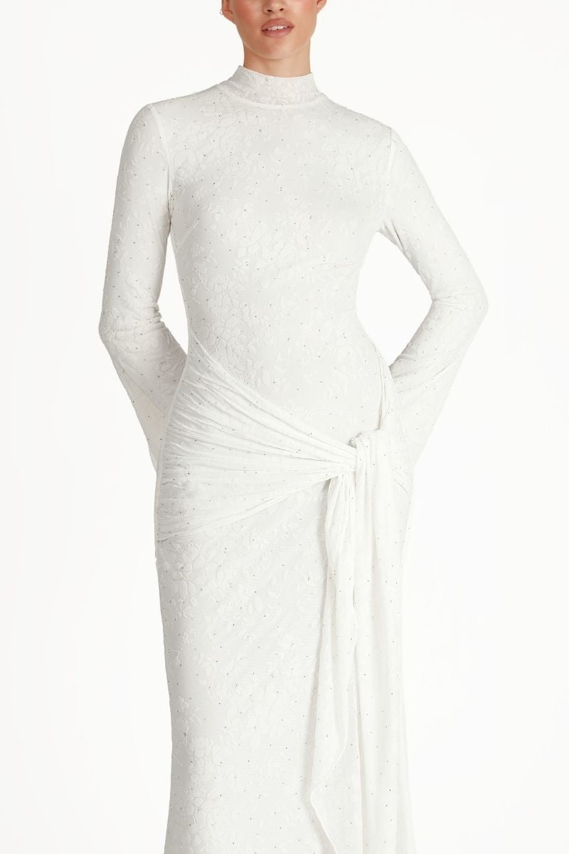 Khanum's KELI white maxi dress with flowing fabric and elegant design, perfect for summer or special occasions.