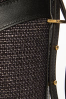 Black VIKELE STUDIO bucket bag with shoulder strap, stylish and compact design, featuring a rounded shape and sleek finish.