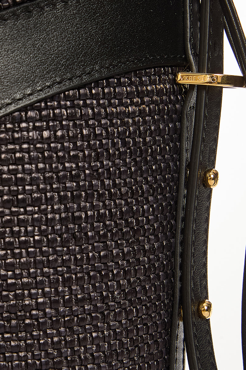 Black VIKELE STUDIO bucket bag with shoulder strap, stylish and compact design, featuring a rounded shape and sleek finish.