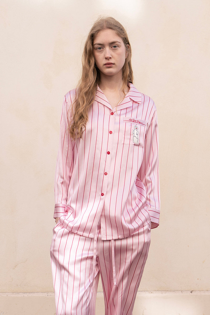 Pink striped silk pajamas from Not Just Pajama's Museum of Crush Long Set, featuring a comfortable, elegant sleepwear design.