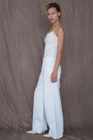 White Audrey jeans by TT Studios, slim-fit denim pants with classic five-pocket design and stylish stitching.