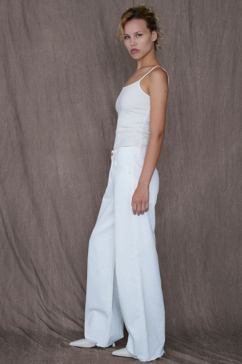 White Audrey jeans by TT Studios, slim-fit denim pants with classic five-pocket design and stylish stitching.