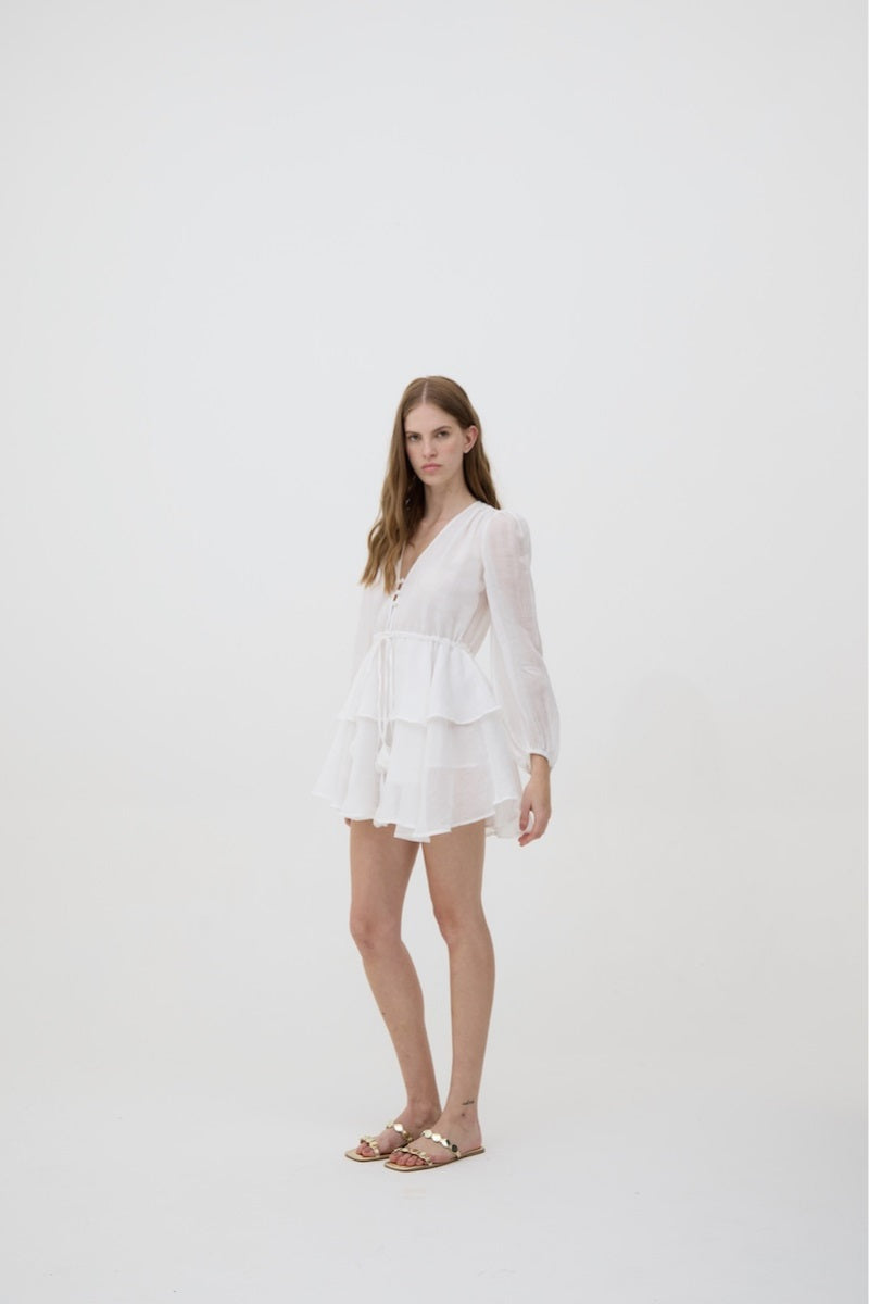 White Sofia dress by Kontenta, a stylish mini dress with a fitted silhouette and elegant design perfect for summery occasions.