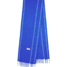 La Granni oversized scarf in blue and cream with soft, woven fabric, draped to showcase its large, cozy design.