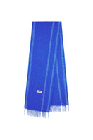 La Granni oversized scarf in blue and cream with soft, woven fabric, draped to showcase its large, cozy design.