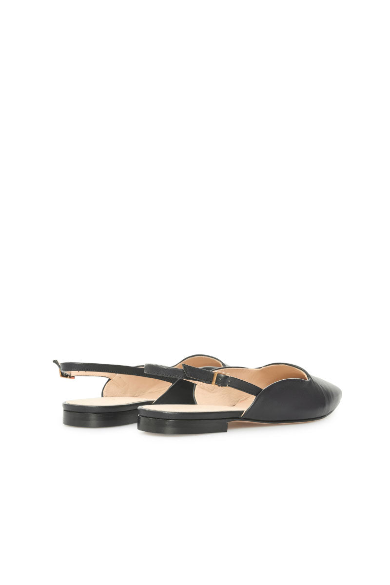 Black Vikele Studio slingback flats sandals with pointed toe and low heel, showcased on a neutral background.