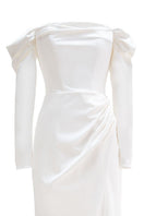 Elegant Cult Mia X Monetre draped gown in soft fabric, featuring a flowing silhouette and subtle detailing.