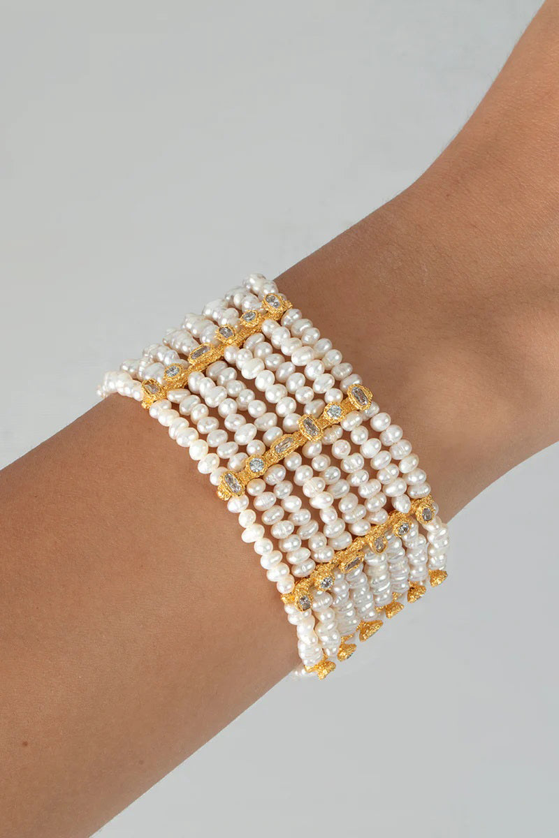 Peracas Patmos Waves Pearl Cuff in ivory, elegant bracelet with pearl accents and wave-inspired design on a white background.