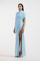 Deme By Gabriella Jovana draped blue maxi dress featuring flowing fabric and elegant design, perfect for formal occasions.