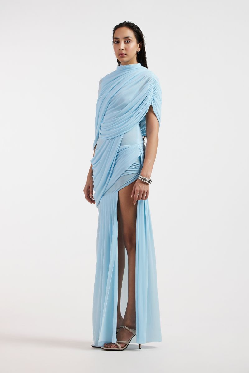 Deme By Gabriella Jovana draped blue maxi dress featuring flowing fabric and elegant design, perfect for formal occasions.