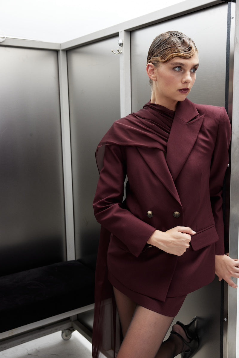 Nazlı Ceren ELODIE Bordeaux jacket with tailored fit, featuring a stylish collar and button closure, displayed on a hanger.