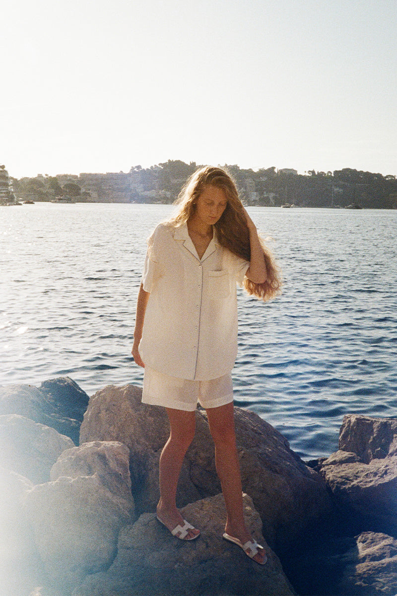 White Hydrasilk short pajamas set by Not Just Pajama with a soft, silky fabric and relaxed fit, displayed on a flat surface.