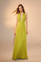 Nazlı Ceren green glow long jersey maxi dress displayed on a model with flowing fabric and elegant design.