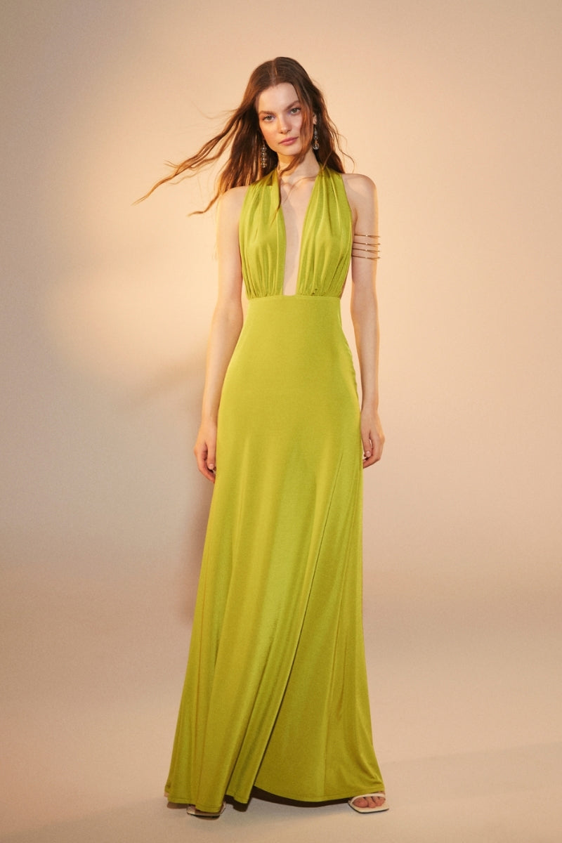 Nazlı Ceren green glow long jersey maxi dress displayed on a model with flowing fabric and elegant design.