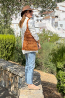 Tan leather shoulder bag by Adriana Castro from La Red Leather collection, featuring a sleek design and adjustable strap.