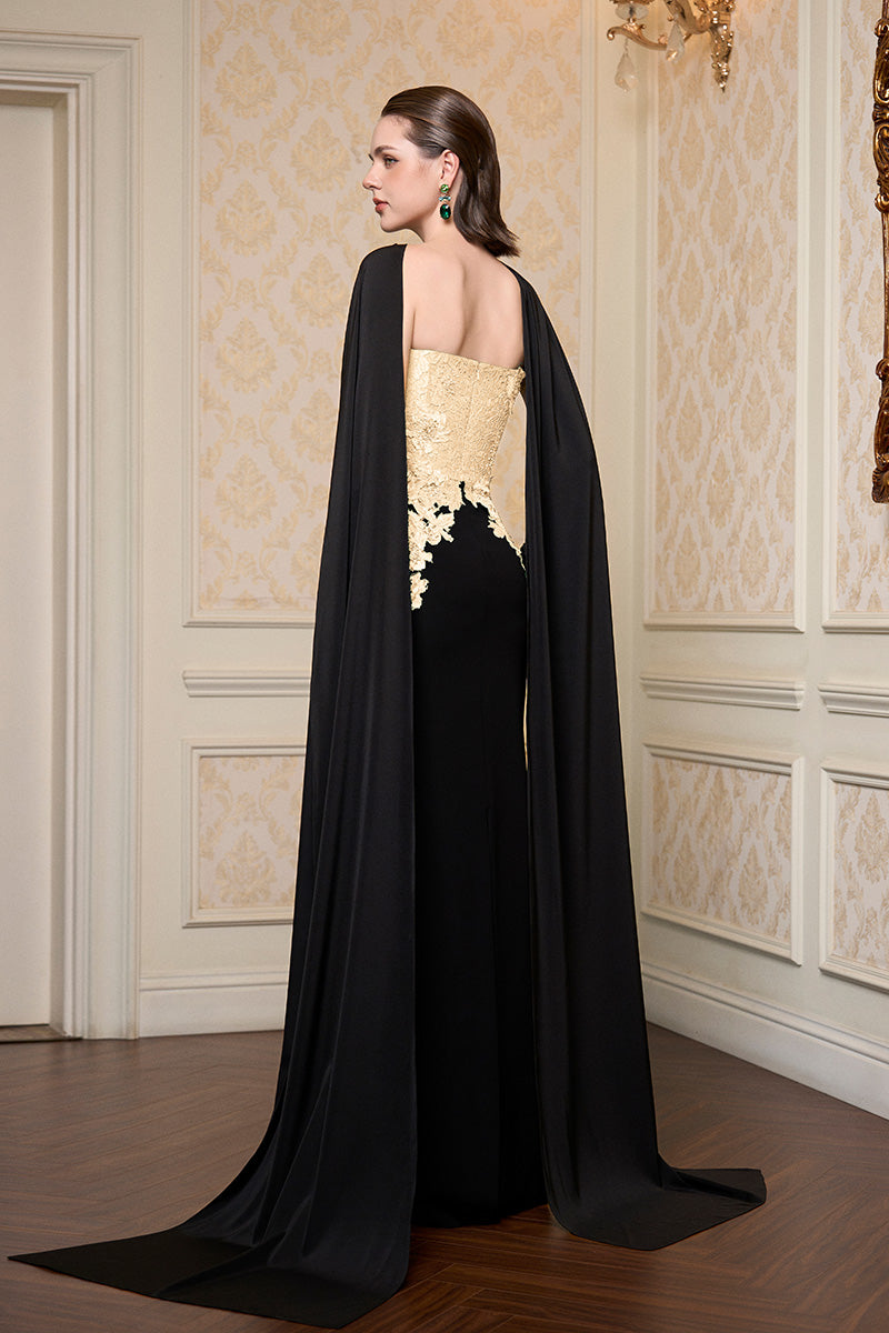 Beige strapless column gown with long cape by I.H.F, elegant evening dress, fitted silhouette, flowing fabric and dramatic cape detail.