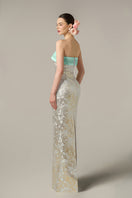 Green metallic jacquard and silk taffeta gown by I.H.F, featuring elegant fabric and intricate design details.