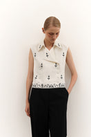 Decorative vest from DELEGAN featuring an ornate ornament design, displayed on a mannequin or laid flat.