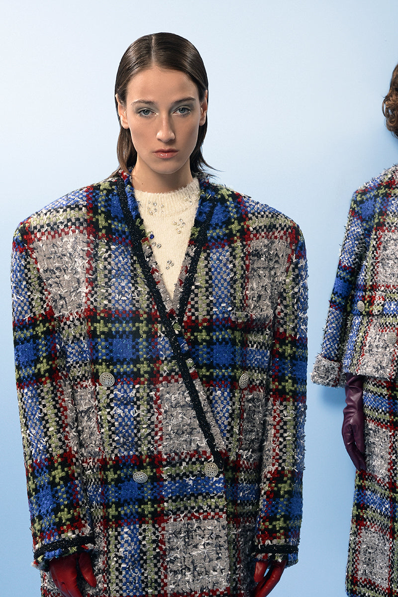 Lalo beige and blue checked wool coat displayed on a hanger, showcasing its classic pattern and tailored fit.
