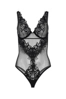 Black OOLOG Bodysuit by Entos, featuring a sleek fit and smooth fabric, displayed on a model against a neutral background.