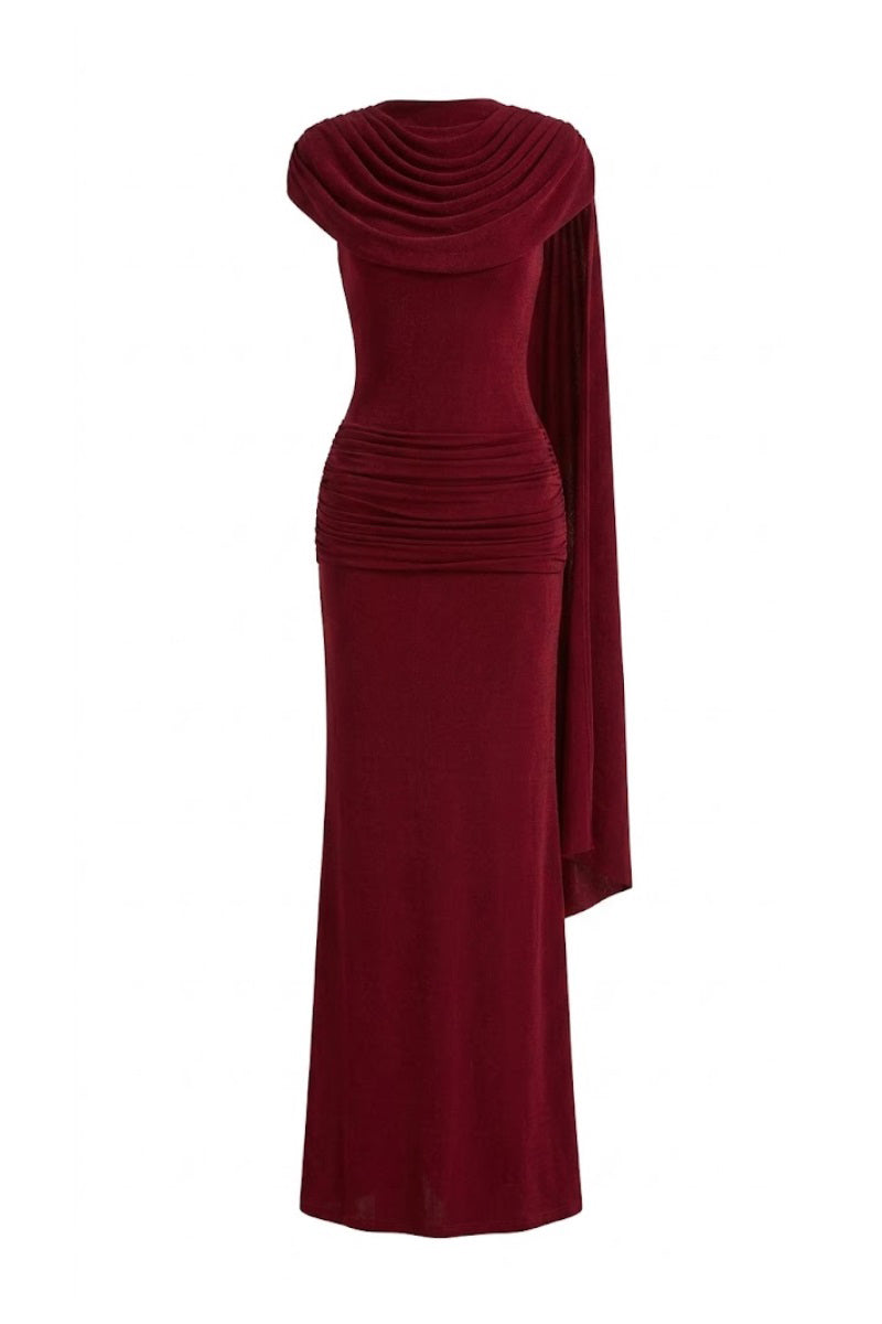 Margée Atelier Bailey Maxi Dress featuring a flowing fabric and elegant design, displayed on a hanger against a neutral background.